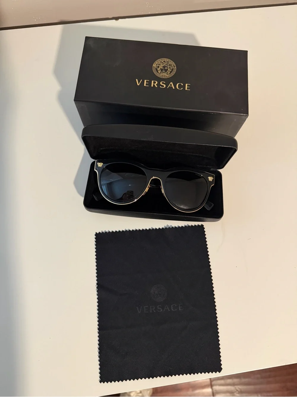 Versace Black and Gold women’s Sunglasses with Dark Lenses